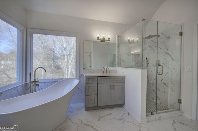 bathroom featuring shower with separate bathtub, vanity, and a wealth of natural light