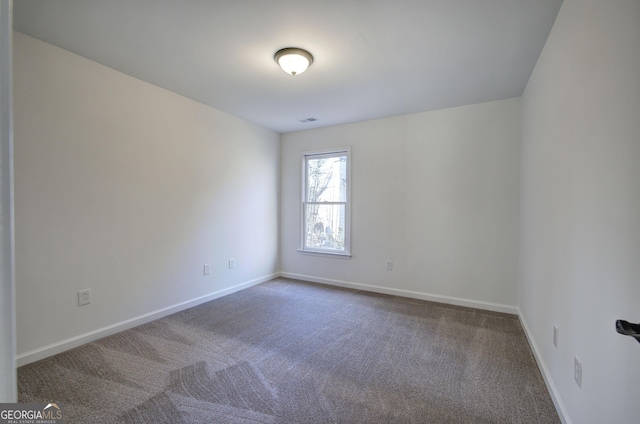 unfurnished room with carpet floors