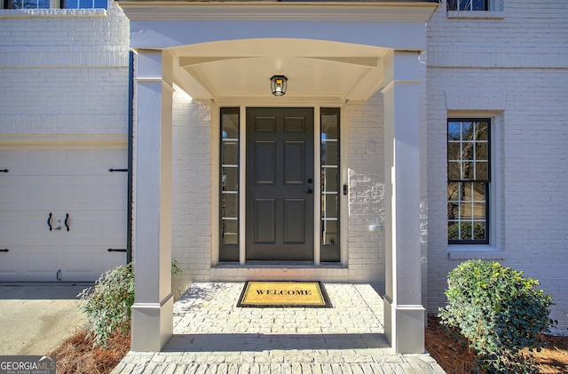 property entrance with a garage