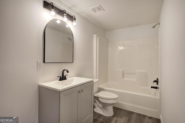 full bathroom with toilet, shower / bath combination, vanity, and hardwood / wood-style floors