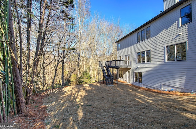 view of yard with a wooden deck