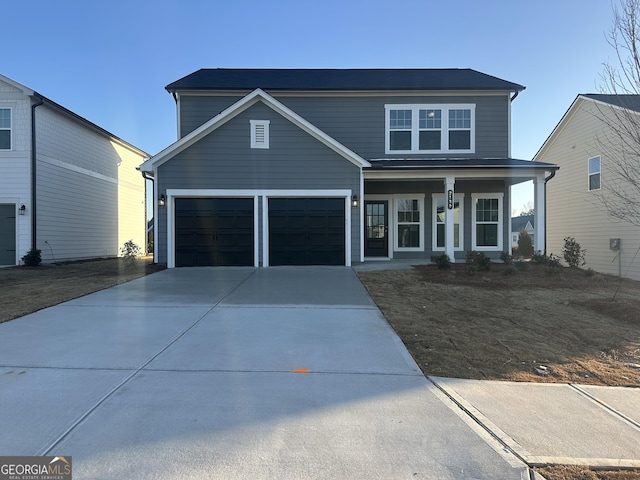 front facade with a garage and a porch