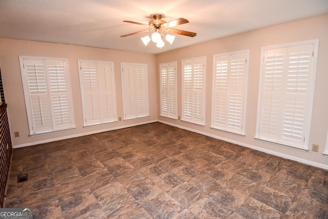 unfurnished room featuring ceiling fan