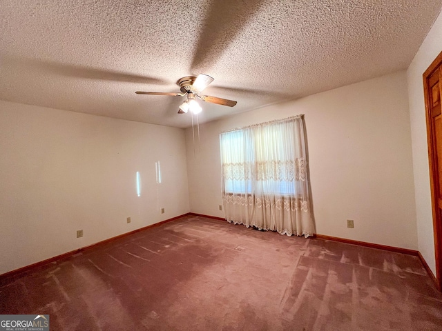 empty room with a textured ceiling, ceiling fan, and carpet flooring