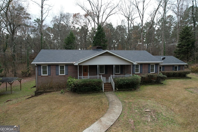 ranch-style house with a front lawn and a porch