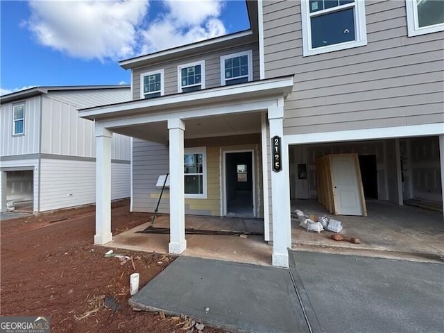 view of exterior entry featuring a garage