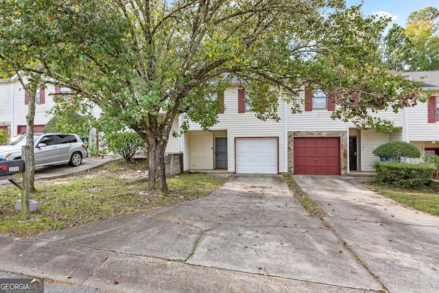 townhome / multi-family property featuring a garage