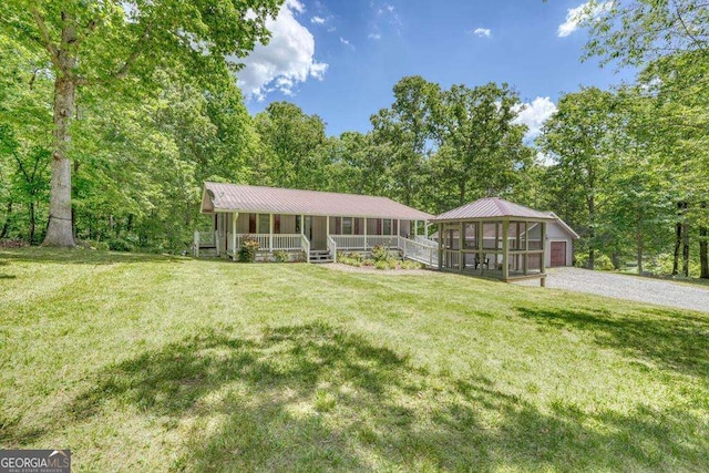 single story home with covered porch and a front yard