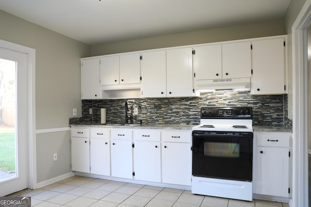 kitchen with decorative backsplash, sink, light tile patterned floors, white electric stove, and white cabinets