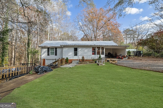 view of front of home with a garage and a front yard