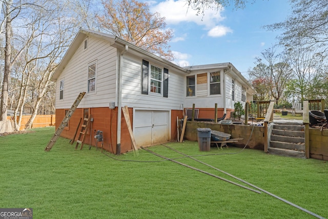 back of house with a yard