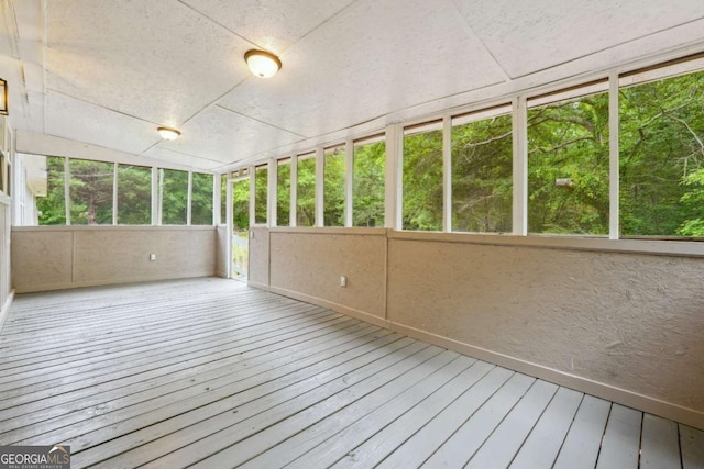 unfurnished sunroom featuring plenty of natural light