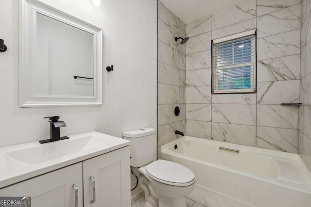 full bathroom with toilet, vanity, and tiled shower / bath