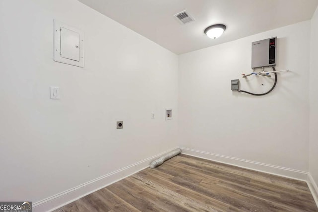 laundry room featuring electric dryer hookup, hardwood / wood-style floors, and washer hookup