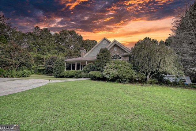 view of front of home with a yard