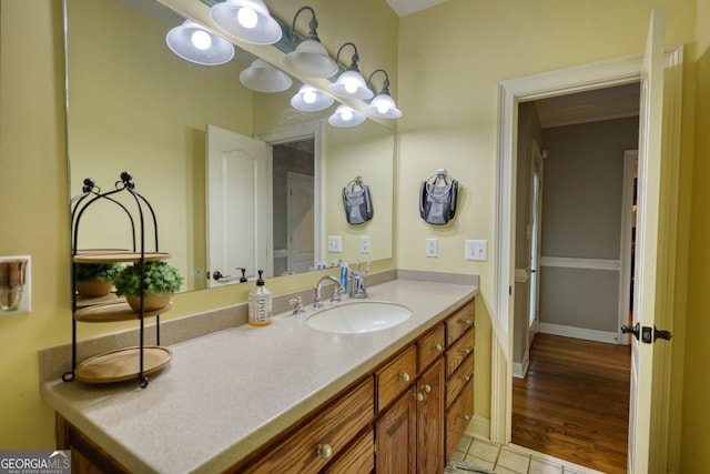 bathroom with tile patterned flooring and vanity