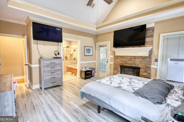 bedroom with lofted ceiling, ensuite bathroom, light hardwood / wood-style flooring, ceiling fan, and ornamental molding