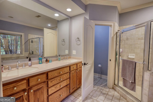 bathroom with vanity, tile patterned floors, an enclosed shower, and crown molding