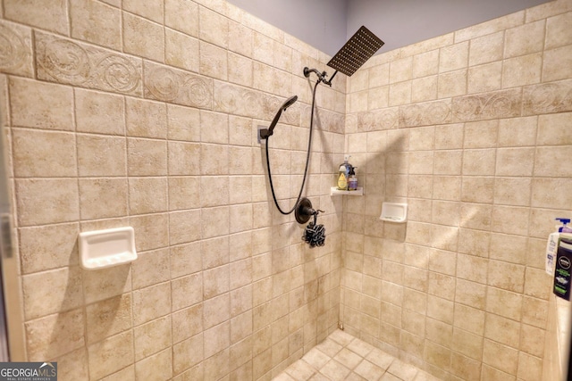 bathroom with tiled shower