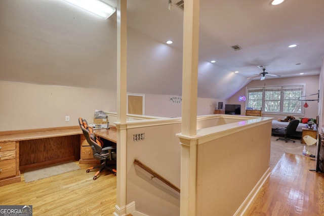 office space featuring ceiling fan, light hardwood / wood-style flooring, and lofted ceiling