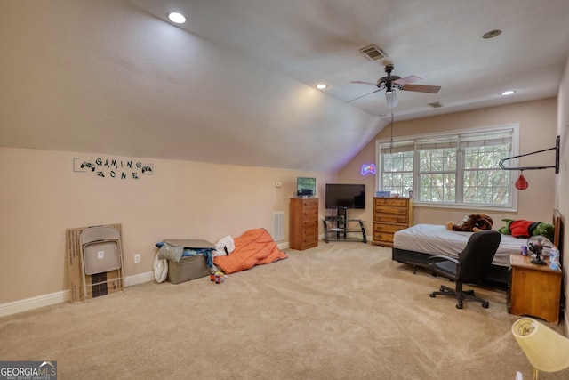 carpeted office space featuring ceiling fan and vaulted ceiling