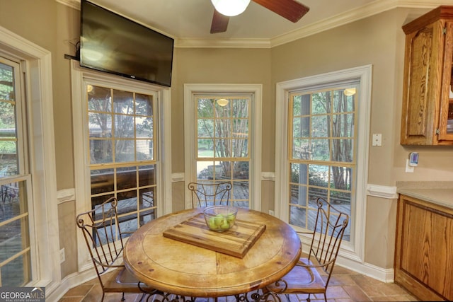 dining room with ceiling fan and ornamental molding