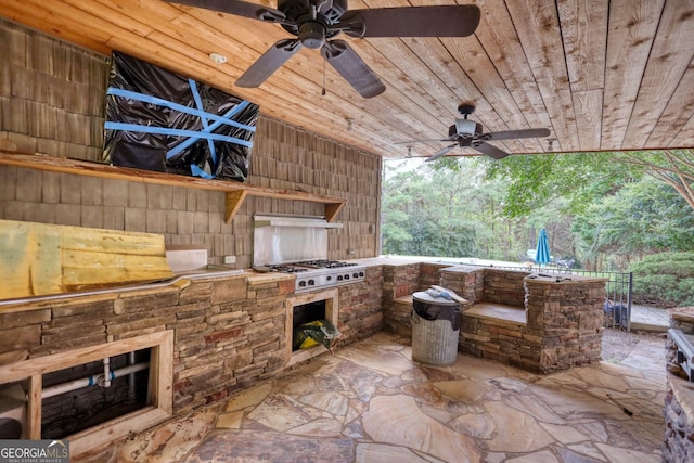 view of patio with area for grilling and ceiling fan