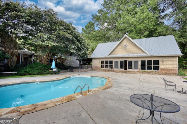 view of swimming pool featuring a patio