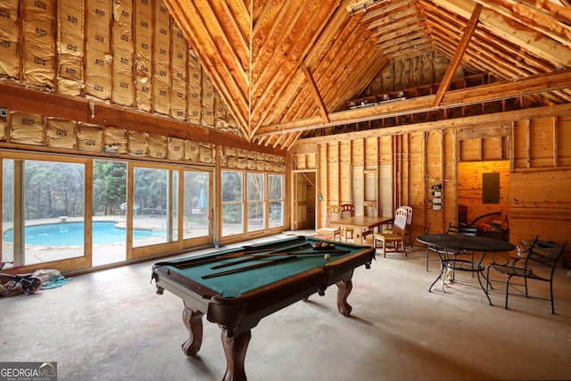 recreation room with high vaulted ceiling and billiards