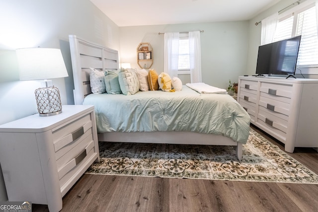 bedroom featuring wood finished floors