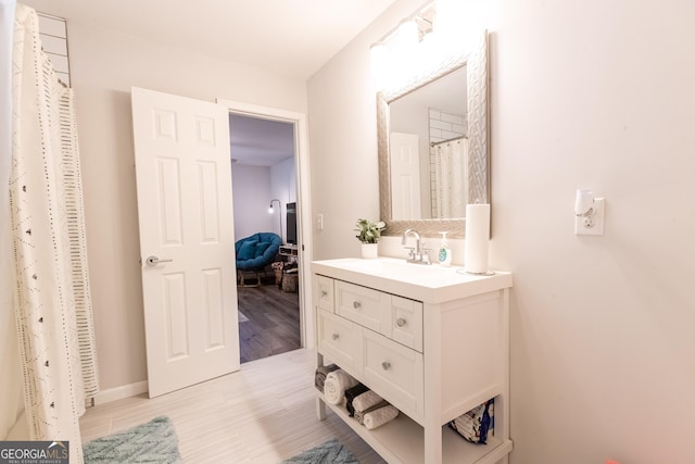 bathroom featuring vanity and wood finished floors