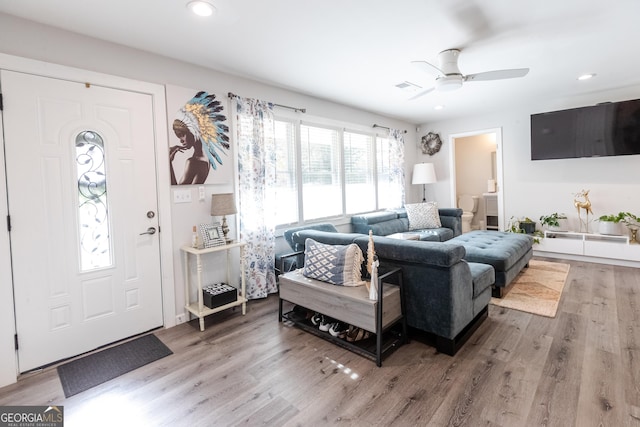 living area featuring a ceiling fan, wood finished floors, visible vents, and recessed lighting