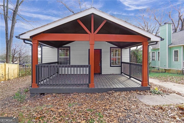 back of property featuring a porch