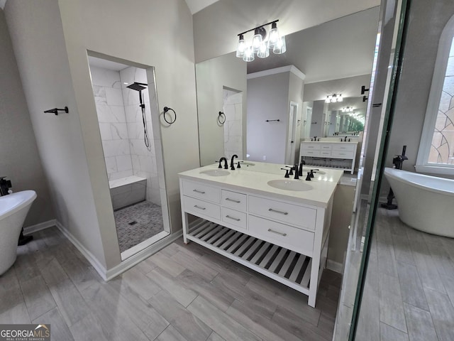 bathroom with plus walk in shower, vanity, and ornamental molding