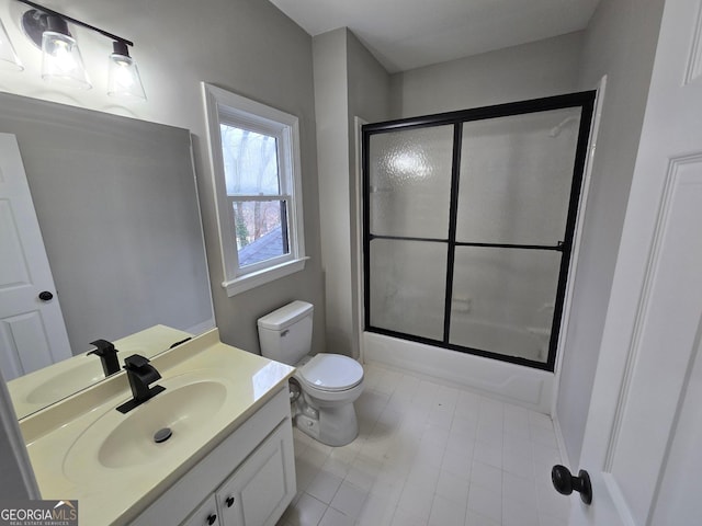 full bathroom featuring vanity, toilet, and enclosed tub / shower combo