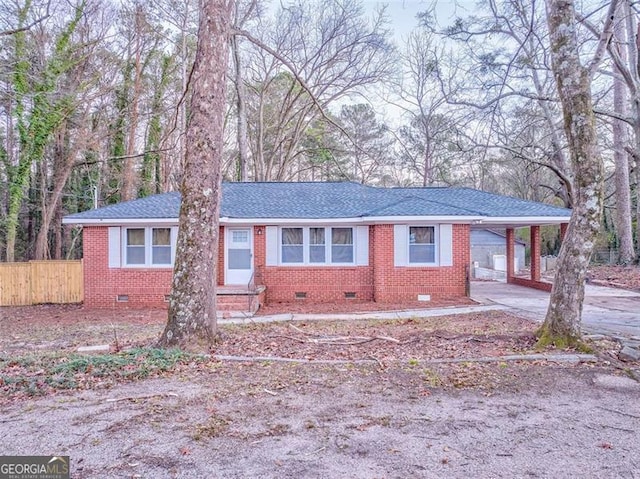 single story home with a carport