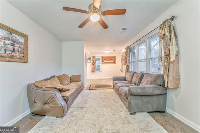 living room with ceiling fan