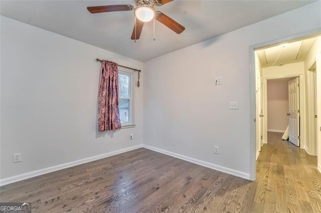 unfurnished room featuring hardwood / wood-style flooring and ceiling fan