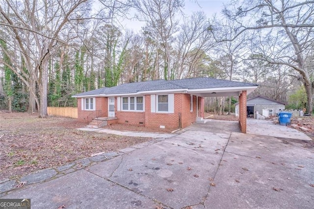 ranch-style house with a carport