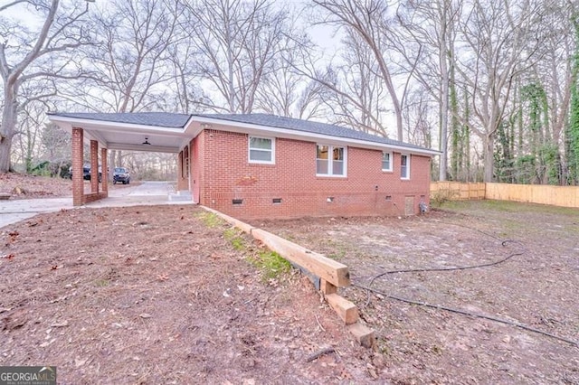 view of property exterior with a carport