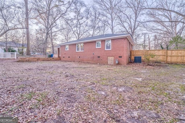 back of property with central AC unit