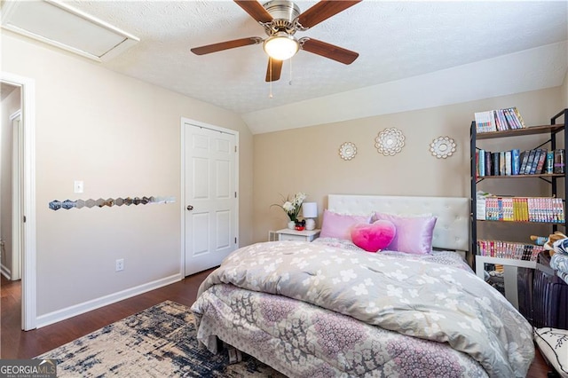 bedroom with dark wood-type flooring, ceiling fan, and lofted ceiling