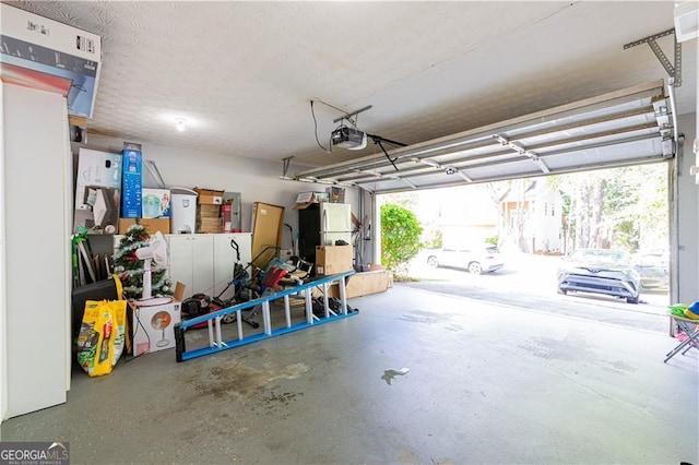 garage featuring refrigerator and a garage door opener