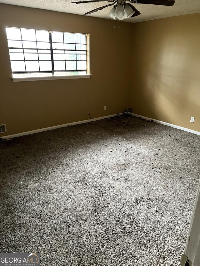 6354 Shannon Pkwy Unit 30D, Union City, GA 30291 - empty room with a textured ceiling and ceiling fan