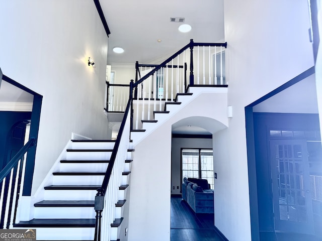 staircase with ornamental molding