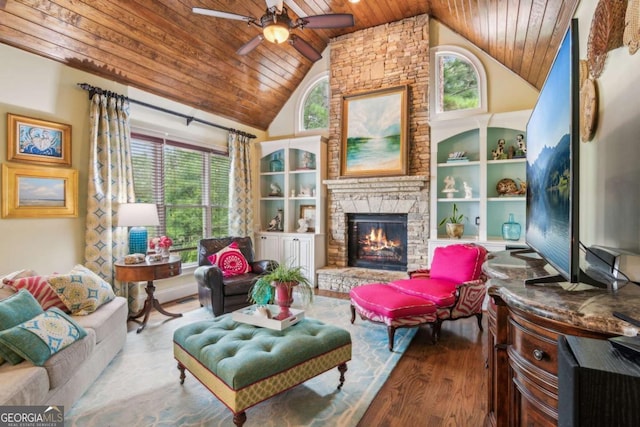 living room featuring hardwood / wood-style floors, high vaulted ceiling, a stone fireplace, ceiling fan, and wood ceiling