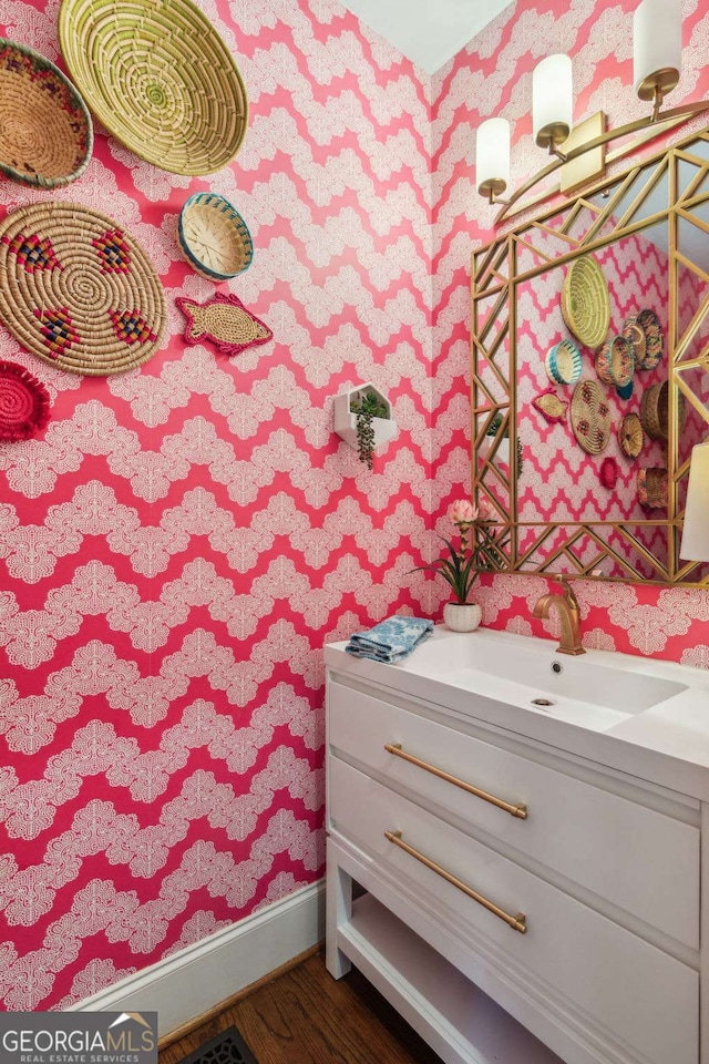 bathroom featuring vanity and wood-type flooring