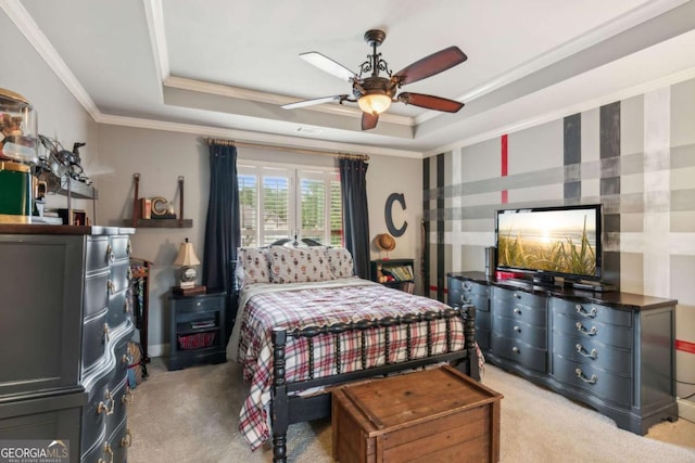 bedroom featuring ceiling fan, a raised ceiling, ornamental molding, and light carpet