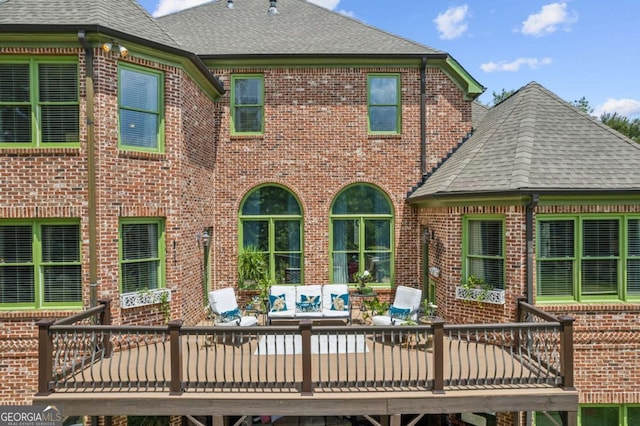 back of property featuring a deck