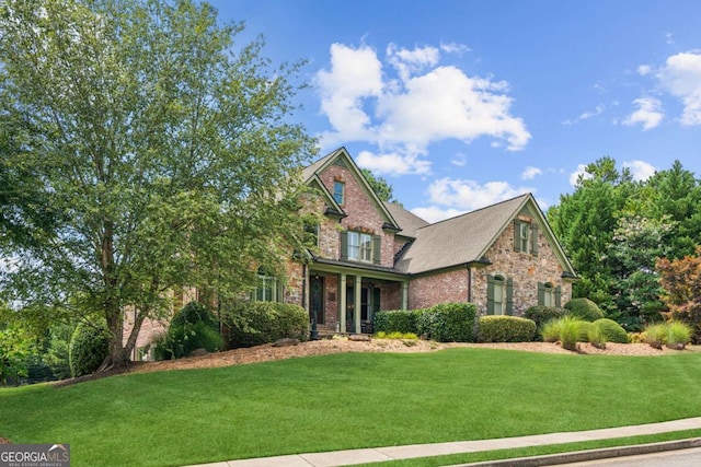 craftsman inspired home with a front lawn